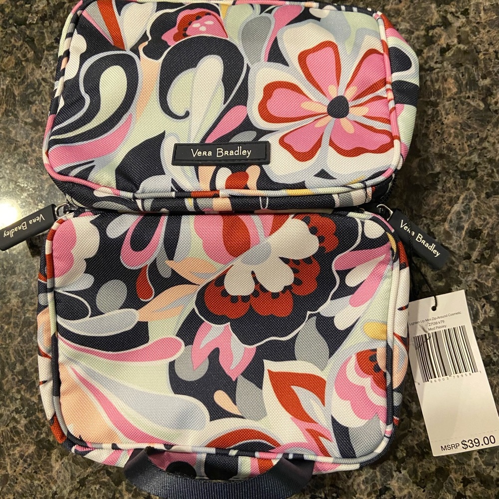 Compact cosmetic bag.  Interior zippered compartment & 3 slip in compartments.
